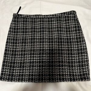 Black shiny mini skirts